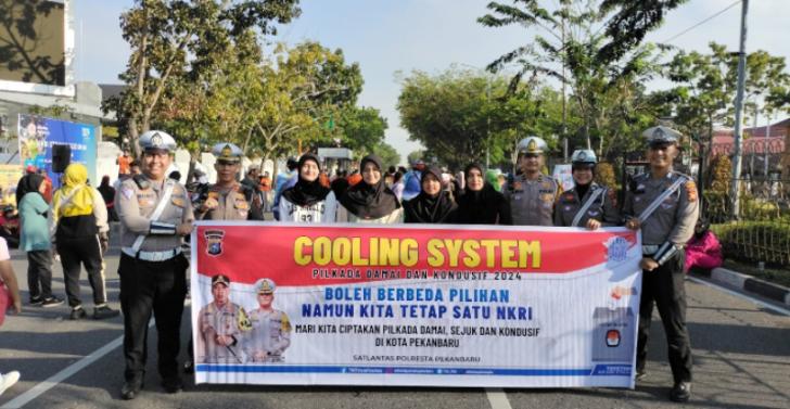 Satlantas Bentangkan Spanduk di CFD Pekanbaru, Pesannya Pilkada Damai, Sejuk dan Kondusif