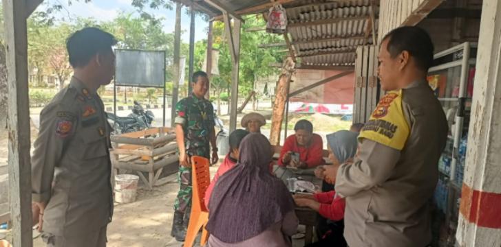 Bhabinkamtibmas Membawa Pesan Pilkada Damai ke Desa Rantau Baru